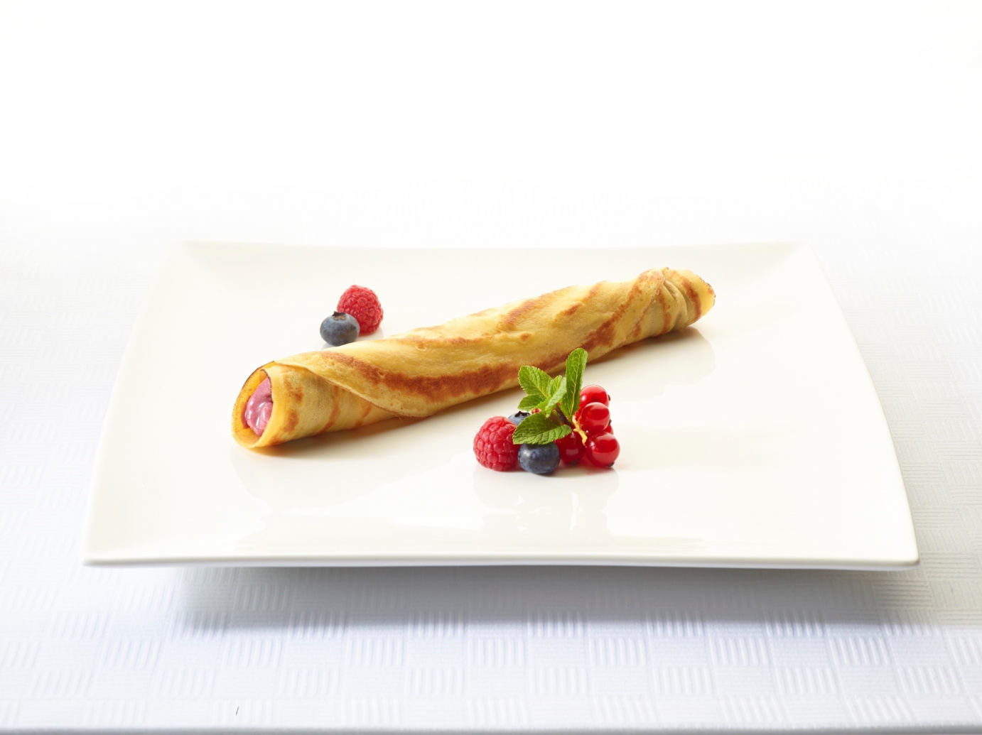 Pancake with forest fruits mousse